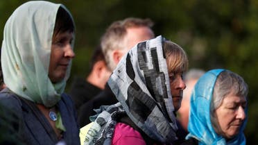 Women wearing head scarfs attend a vigil for the victims of the mosque attacks. (Reuters)