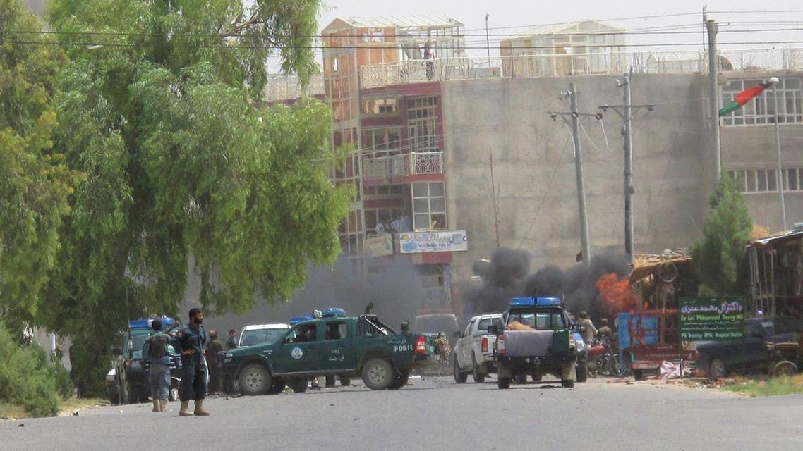 Afghan Police is seen the the site of explosion in Lashkar Gah, the capital of Helmand province. ( =AP)