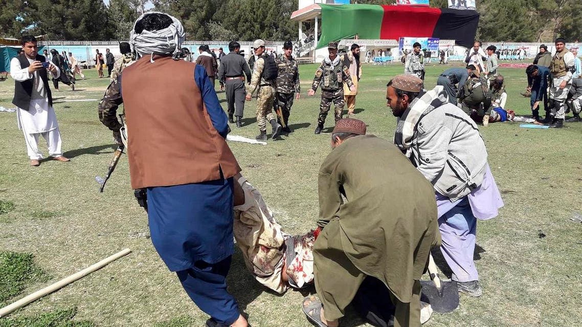 Police and civilians lie on the ground after multiple explosions in Lashkar Gah city of Helmand province, southern Afghanistan, Saturday, Mar. 23, 2019. (AP)