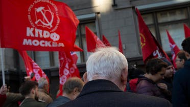 Communist party supporters hold red flags during a protest against the government's plans to raise the retirement age, in front of the Russian State Duma, the Lower House of the Russian Parliament in Moscow, Russia, Wednesday, Sept. 26, 2018 (AP)