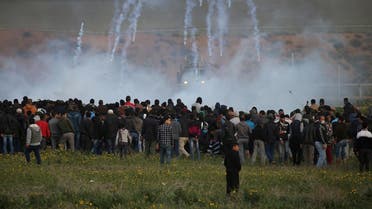 Tear gas canisters are fired by Israeli troops toward Palestinians during a protest at the Israel-Gaza border fence. (File photo: Reuters)
