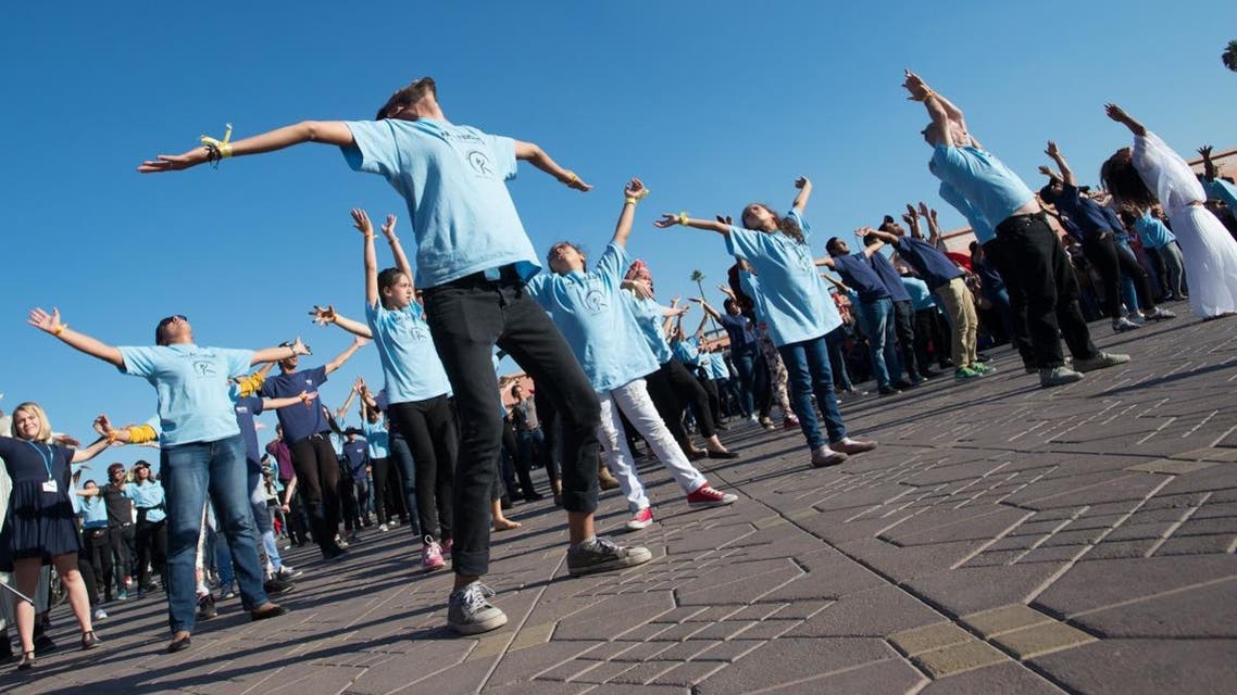 oung activists at the COP22 UN climate summit take part in a flash-mob dance protest in Jemaa el-Fnaa, the central plaza in Marrakesh, Morocco, November 10, 2016. - Image SHUTTERSTOCK