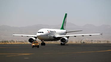 An airplane of Mahan Air sits at the tarmac after landing at Sanaa International Airport in the Yemeni capital on March 1, 2015 a day after officials from the Shiite militia-controlled city signed an aviation agreement with Tehran. Western-backed President Abedrabbo Mansour Hadi, who fled last weekend an effective house arrest by the Huthis in Sanaa, slammed the agreement as illegal, according to an aide. AFP PHOTO / MOHAMMED HUWAIS 