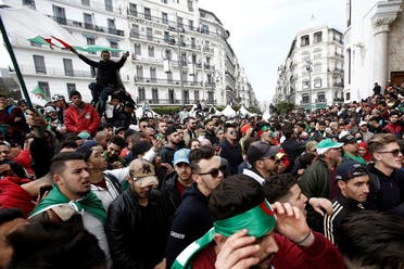 People carry national flags during a protest in Algiers calling on President Abdelaziz Bouteflika to quit. (Reuters)