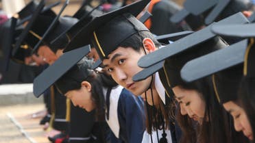 Students bow as they pay homage to great sages during their graduation ceremony at Sungkyunkwan University in Seoul on Feb. 24, 2012. (File photo: AP)