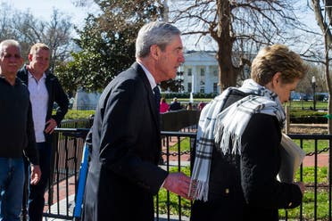 Special Counsel Robert Mueller, and his wife Ann, pass the White House as they walk to their car. (AP)
