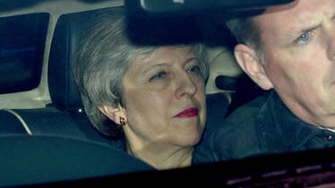 Britain's Prime Minister Theresa May is seen in a car outside the Houses of Parliament in London. (Reuters)