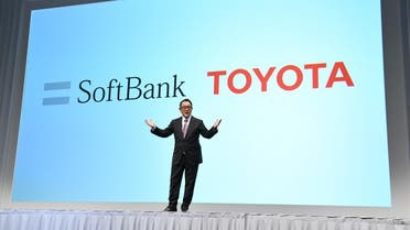 Toyota Motor president Akio Toyoda delivers a speech during a joint press conference with SoftBank in Tokyo. (AFP)
