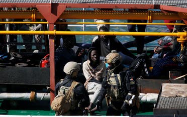  Maltese Special Forces soldiers guard a group of migrants on the merchant ship Elhiblu 1 after it arrived in Valletta’s Grand Harbour, Malta on March 28, 2019. (Reuters)