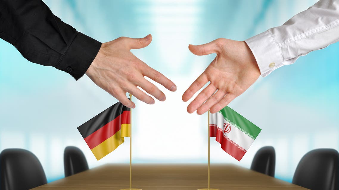 Germany and Iran diplomats agreeing on a deal - Stock image