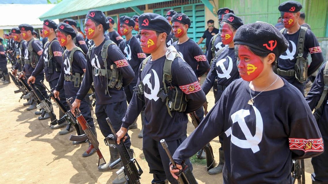 New People’s Army guerillas, the armed wing of the Maoist rebels, stand in formation during the turnover ceremony of captured government soldiers In southern island of Mindanao. (File photo: AFP)