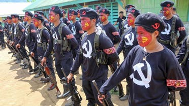 New People’s Army guerillas, the armed wing of the Maoist rebels, stand in formation during the turnover ceremony of captured government soldiers In southern island of Mindanao. (File photo: AFP)