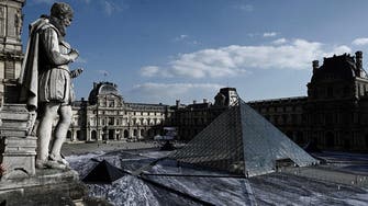 Amid gripes, Louvre pyramid celebrates 30 years with collage