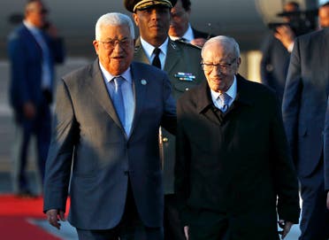 Tunisian President Beji Caid Essebsi (R) welcomes his Palestinian counterpart Mahmoud Abbas upon his arrival at Tunis-Carthage international airport on March 30, 2019, to attend the Arab Summit tomorrow. (AFP)