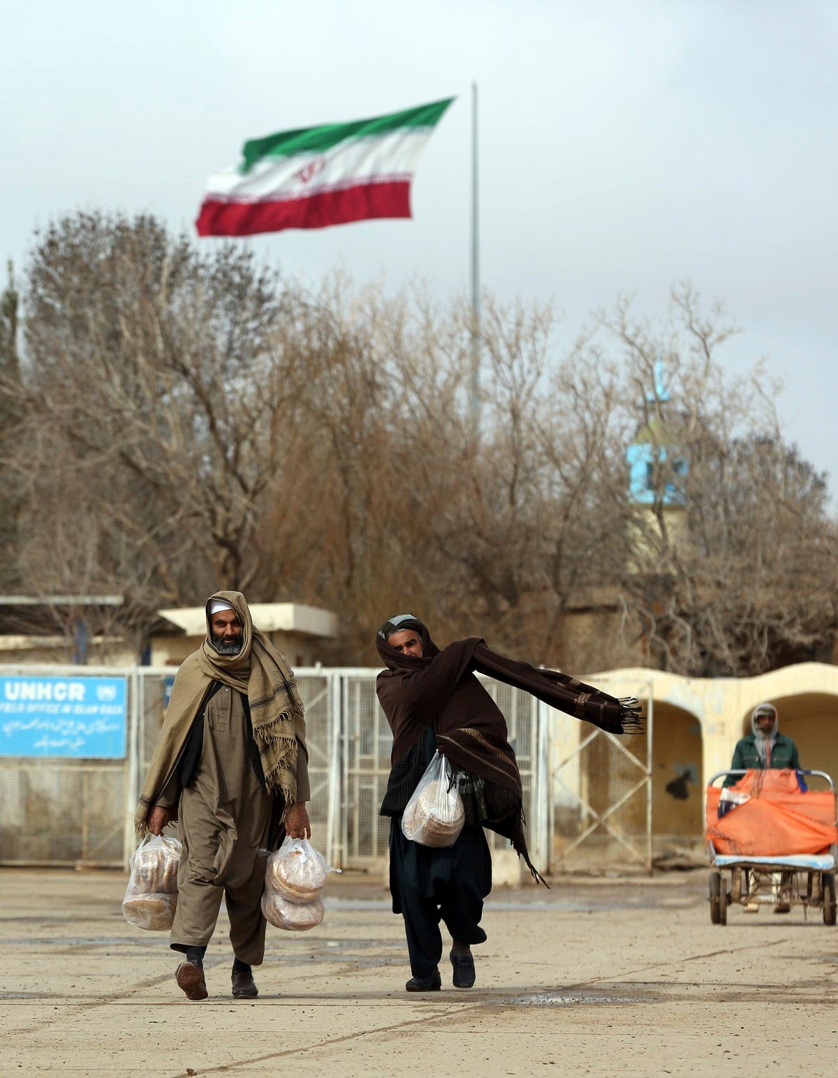 Afghans return to Afghanistan at the Islam Qala border with Iran, in the western Herat Province. (AP)