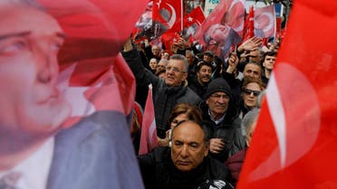 Supporters of the main opposition Republican People's Party mayoral candidate Imamoglu wave Turkish flags and portraits of Mustafa Kemal Ataturk during a rally for the upcoming local elections in Istanbul. (Reuters)
