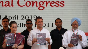 Rahul Gandhi (C), President of India’s main opposition Congress party, his mother and leader of the party Sonia Gandhi and India’s former Prime Minister Manmohan Singh (R) display copies of their party’s election manifesto for the April/May general election in New Delhi, India, April 2, 2019. (Reuters)