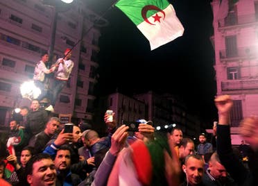 People celebrate on the streets after Algeria’s President Abdelaziz Bouteflika has submitted his resignation, in Algiers on April 2, 2019. (Reuters)