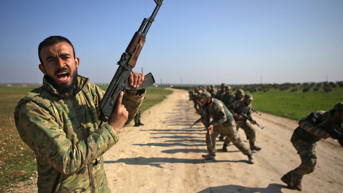 Turkish-backed fighters take part in a training at a military barracks, north of the Syrian town of Manbij on March 6, 2019.