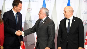 US Deputy Secretary of State John J. Sullivan (C) shakes hands with Britain’s Foreign Secretary Jeremy Hunt next to France’s Foreign minister Jean-Yves Le Drian at the Foreign ministers of G7 nations in Dinard, on April 5, 2019. (AFP)