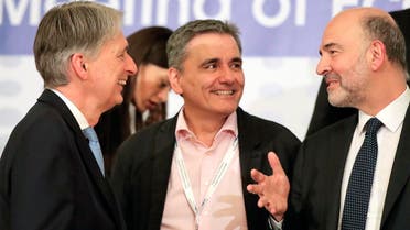 British Chancellor of the Exchequer Philip Hammond, (left), Greek Finance Minister Euclid Tsakalotos, center, and European Commissioner for Economic and Financial Affairs Pierre Moscovici at the informal meeting of European Union Economic Financial Affairs in Bucharest, Romania, on April 5, 2019. (AP)