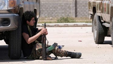 A member of Libyan National Army (LNA), commanded by Khalifa Haftar, holds his weapon as he heads out of Benghazi to reinforce the troops advancing to Tripoli, in Benghazi, Libya April 7, 2019. (Reuters)