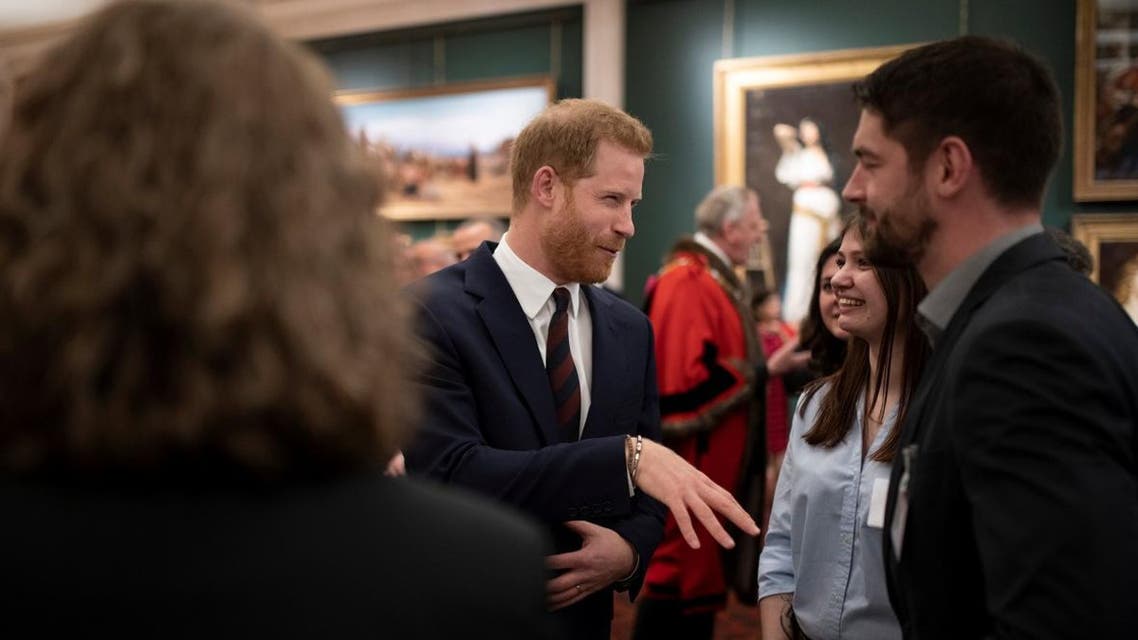 Britain’s Prince Harry meets guests as he attends the Lord Mayor’s Big Curry Lunch, in aid of the three national service charities, at the Guildhall in London, on April 4, 2019. (Reuters)