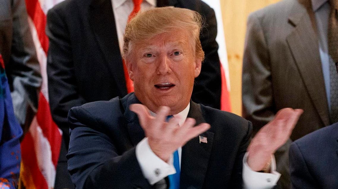 President Donald Trump speaks with reporters about border policy during a fundraising event. (AP)