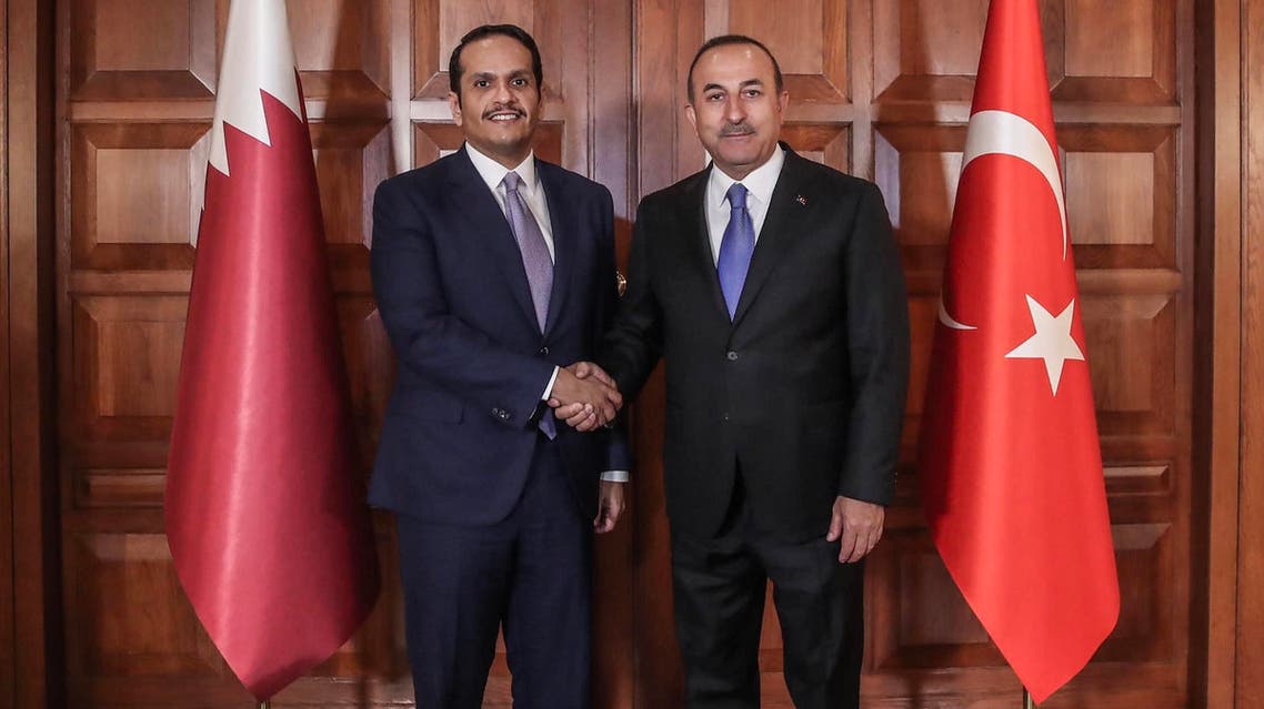Mevlut Cavusoglu (R) with Mohammed bin Abdulrahman al-Thani (L) in Ankara on April 9, 2019. (AFP)