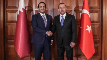 Mevlut Cavusoglu (R) with Mohammed bin Abdulrahman al-Thani (L) in Ankara on April 9, 2019. (AFP) 
