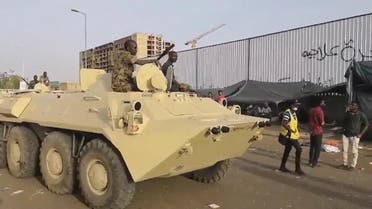 Military vehicles patrol the streets of Khartoum