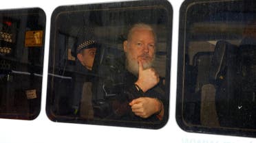 A bearded and frail-looking Julian Assange being arrested by British police in London on April 11, 2019. (Reuters)