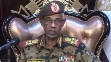 A grab from a live broadcast on Sudan TV shows Sudanese Defense Minister Ahmed Awad Ibnouf delivering a speech in Khartoum, announcing that President Omar al-Bashir was removed from power on April 11, 2019. (AFP)