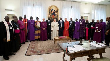 Francis poses for a photo with participants of a two day Spiritual retreat with South Sudan leaders at the Vatican, April 11, 2019