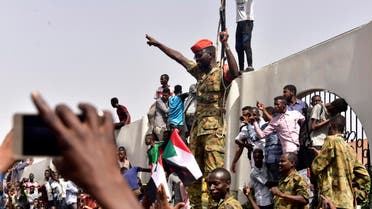 Members of the Sudanese military gather in a street in central Khartoum on April 11, 2019. (AFP)