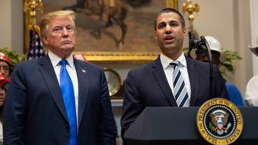 US President Donald Trump listens to Federal Communications Commission (FCC) chairman Ajit Pai speak during an announcement about 5G network deployment in the Roosevelt Room at the White House in Washington, DC, on April 12, 2019. (AFP)