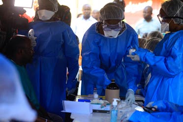 Healthcare workers from the World Health Organization prepare to give an Ebola vaccination to a front line aid worker in Beni Democratic Republic of Congo, Friday, Aug 10, 2018.  (AP)