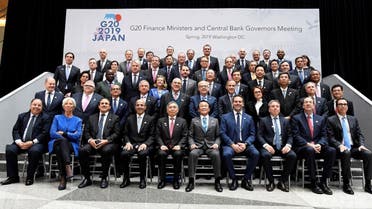 Finance ministers and central bank governors gather for a group photo during the IMF and World Bank’s 2019 Annual Spring Meetings, in Washington, April 12, 2019. (Reuters)