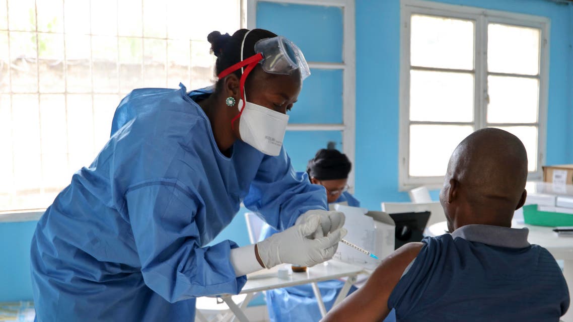 File photo of a healthcare worker from the World Health Organization, left, gives an Ebola vaccination to a front line aid worker who will then go to vaccinate people who might potentially have the virus (AP)
