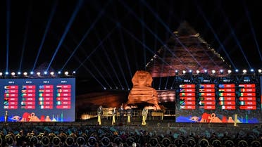 This picture taken on April 12, 2019 during the 2019 CAF African Cup of Nations (CAN) draw ceremony shows the pots' composition with the Pyramid of Khafre (Chephren) and the Sphinx in the background at the Giza Pyramids Necropolis on the western outskirts of the Egyptian capital Cairo. KHALED DESOUKI / AFP