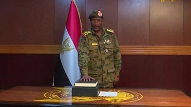 A grab from a broadcast on Sudan TV shows Lieutenant General Abdel Fattah al-Burhan Abdulrahman taking oath on April 12, 2019 as chief of the new military council, in the capital Khartoum. (AFP)