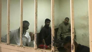 File photo of suspected ISIS members sits inside a cell at a court in Baghdad on May 10, 2018. (AFP)