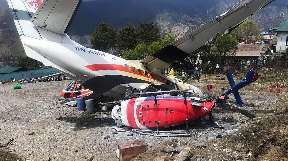 A Summit Air Let L-410 Turbolet aircraft bound for Kathmandu is seen after it hit two helicopters during take off at Lukla airport. (AFP)