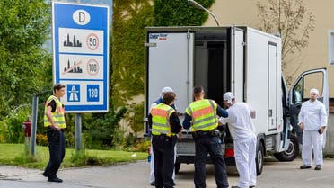 German police officers check a refrigerated truck at the check point during a border control on the border crossing between Austria and Germany at the southern German city of Kiefersfelden on September 16, 2015. (AFP)