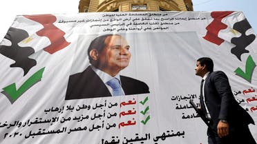 A man walks in front of a banner reading, "Yes to the constitutional amendments, for a better future", with a photo of the Egyptian President Abdel Fattah al-Sisi before the approaching referendum on constitutional amendments in Cairo. (Reuters)