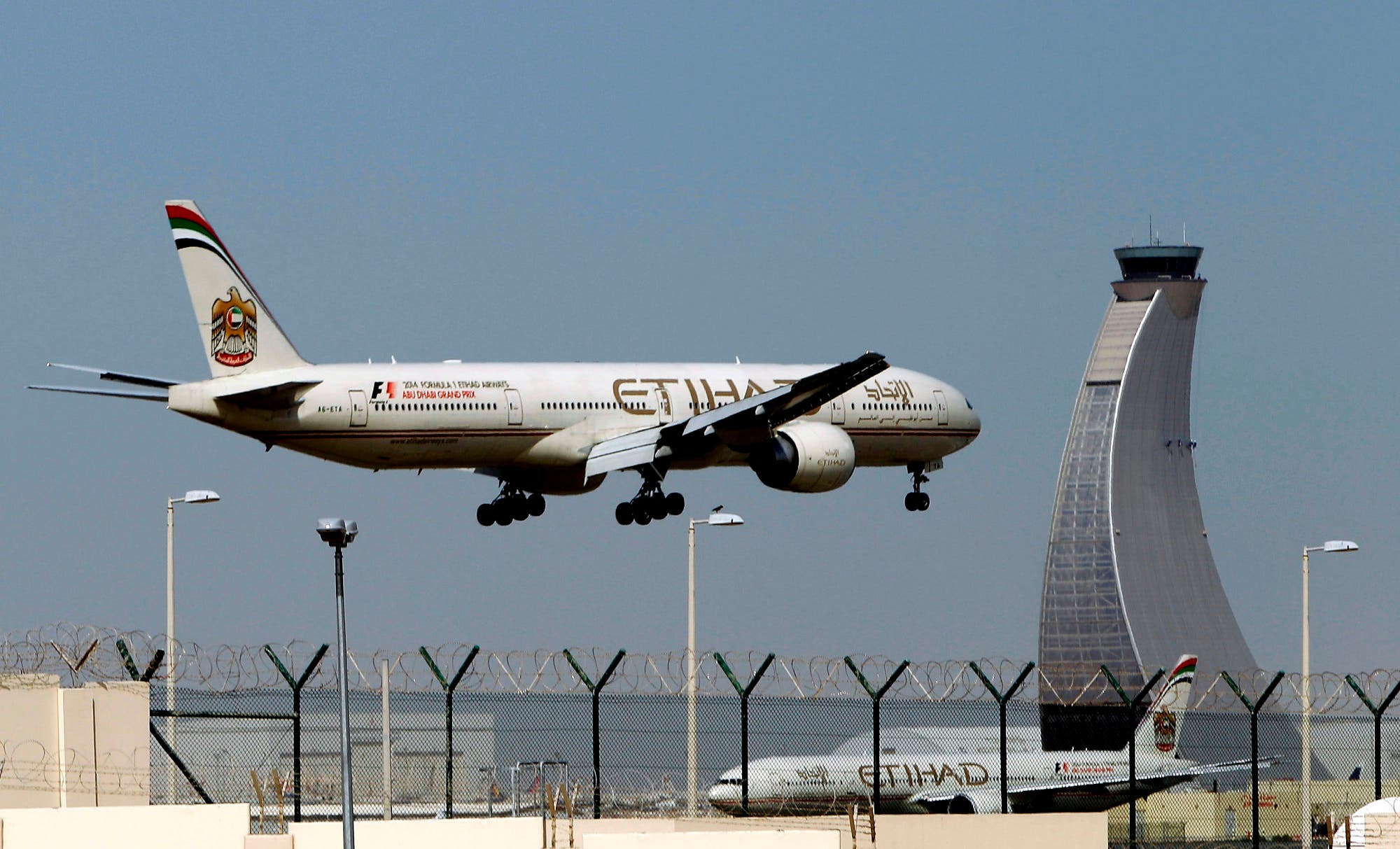 An Etihad Airways plane prepares to land at the Abu Dhabi airport on May 4, 2014. (AP)
