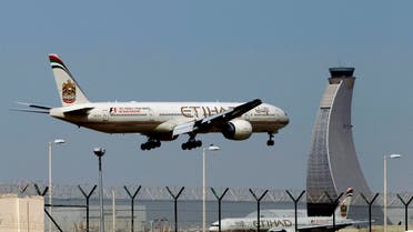 An Etihad Airways plane prepares to land at the Abu Dhabi airport on May 4, 2014. (AP)