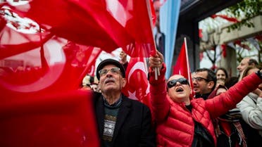 Supporters listen to main opposition Republican People's Party (CHP) mayoral candidate, Ekrem Imamoglu (unseen), during a rally following local elections in the Turkish city of Istanbul. (AFP)