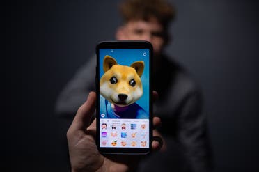 An AFP collaborator poses for a picture using the smart phone application TikTok in Paris on December 14, 2018. (AFP)