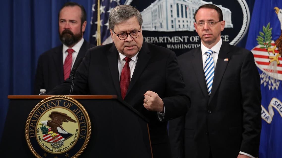 US Attorney General William Barr speaks about the release of the redacted version of the Mueller report as US Deputy Attorney General Rod Rosenstein (R) and US Acting Principal Associate Deputy Attorney General Ed OCallaghan listen at the Department of Justice April 18, 2019 in Washington, DC. (AFP)